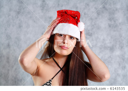 Young sexy Santa in bikini isolated on grey 6143535