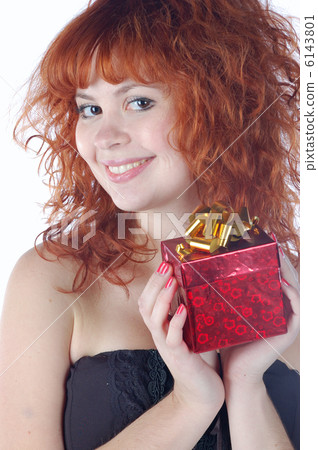 face of red-haired pretty girl with gift 6143801