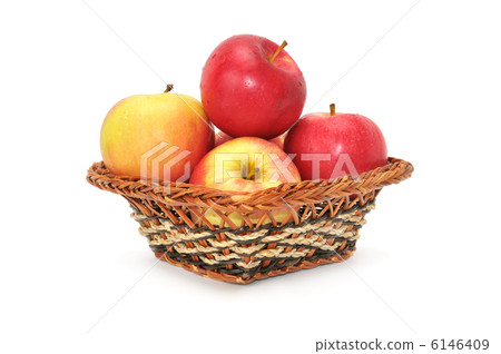 apples in basket isolated on white background 6146409
