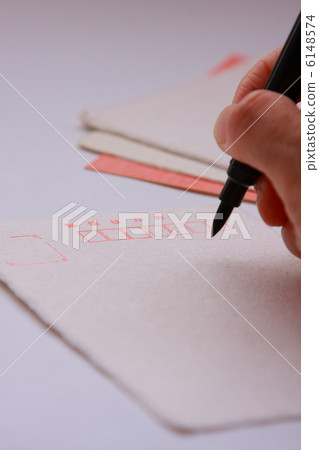 Write a letter on a Japanese paper's leaflet with a brush (white background) 6148574