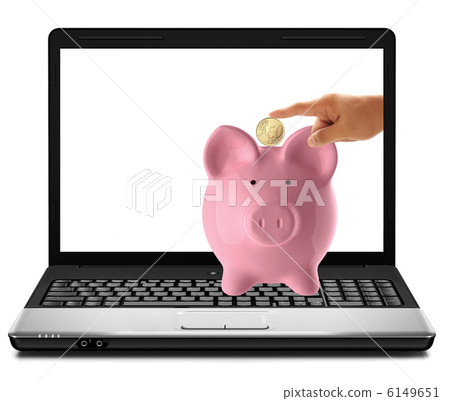 hand inserting a coin into a laptop 6149651