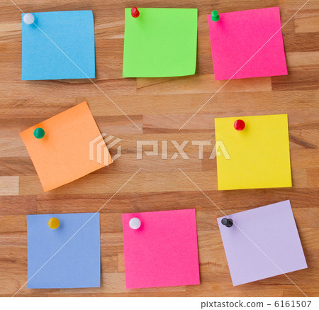 colorful sheets of paper on wooden board 6161507