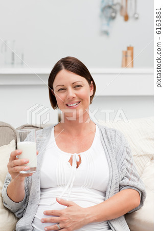 Pregnant woman drinking milk Pregnant woman drinking milk 6163881