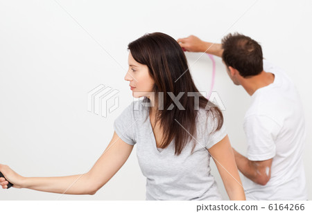Man drawing a heart while his girlfriend painting a wall Man drawing a heart while his girlfriend painting a wall 6164266