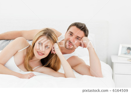 Happy lovers looking at the camera Happy lovers looking at the camera 6164509