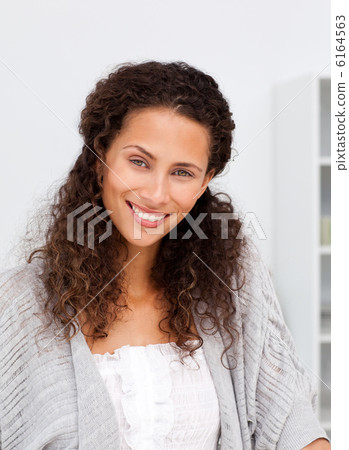 Cute woman looking at the camera standing in a kitchen 6164563