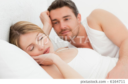 Boyfriend looking at his girlfriend who is sleeping Boyfriend looking at his girlfriend who is sleeping 6164711