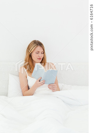 Beautiful girl reading a book 6164716