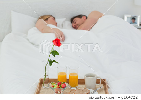 Lovers sleeping after having breakfast Lovers sleeping after having breakfast 6164722