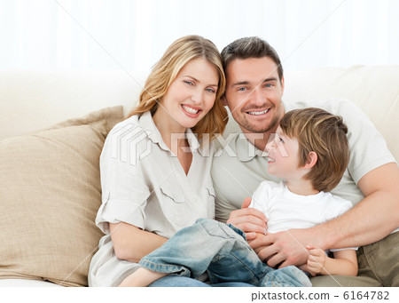 Happy family on their sofa 6164782