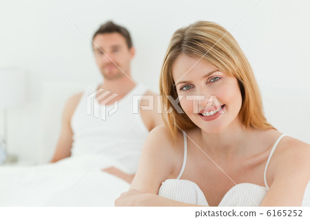 Superb woman looking at the camera with her husband Superb woman looking at the camera with her husband 6165252