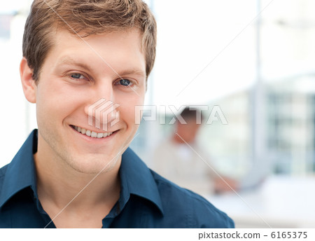 Happy businessman in his office 6165375