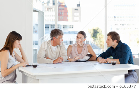 Coworkers working in their office 6165377