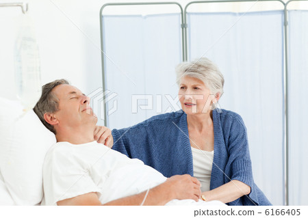 Mature woman taking care of her husband Mature woman taking care of her husband 6166405