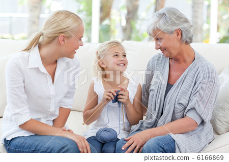 Family knitting together at home Family knitting together at home 6166869