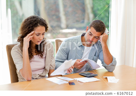 Young couple calculating their domestic bills 6167012