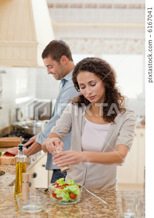 Handsome man cooking with his girlfriend Handsome man cooking with his girlfriend 6167041