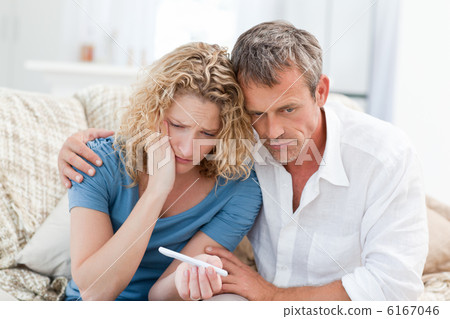 Lovers looking at a pregnancy test Lovers looking at a pregnancy test 6167046