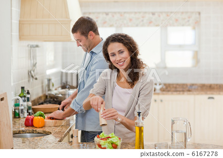 Handsome man cooking with his girlfriend Handsome man cooking with his girlfriend 6167278
