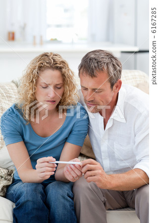 Lovers looking at a pregnancy test Lovers looking at a pregnancy test 6167285
