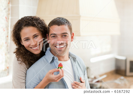 Lovely couple looking at the camera Lovely couple looking at the camera 6167292