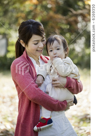 Mother holding a baby 6169350
