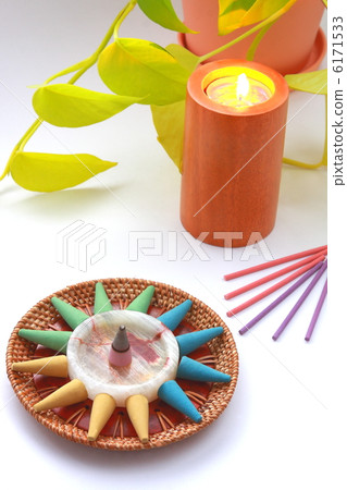 Colorful incense and candles and ornamental plants (white background) Colorful incense and candles and ornamental plants (white background) 6171533