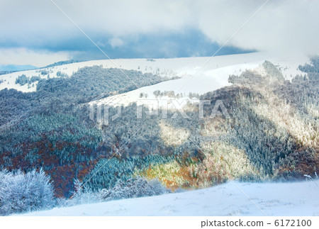 First winter snow in mountain and inclement windy weather beginn 6172100