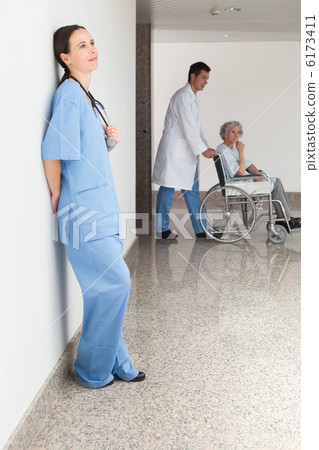Nurse leaning against wall Nurse leaning against wall 6173411