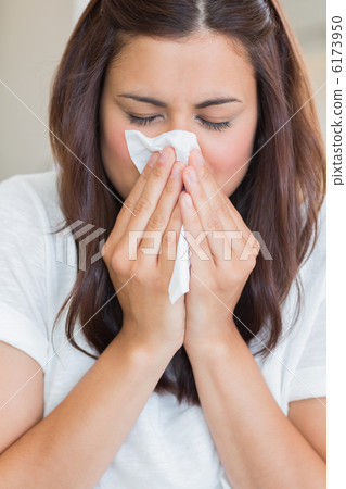 Sick woman with tissue Sick woman with tissue 6173950