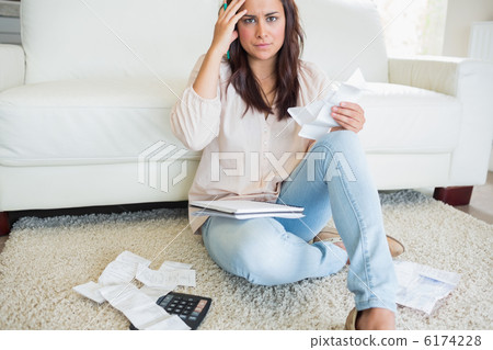 Woman worrying about finances Woman worrying about finances 6174228