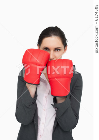 Combative brunette wearing red gloves Combative brunette wearing red gloves 6174308