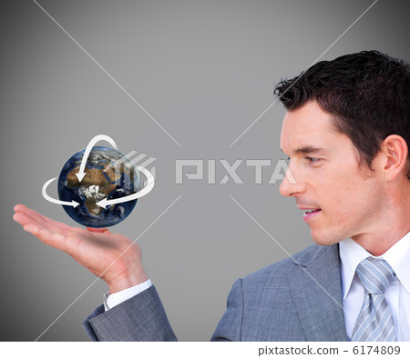Hovering globe in businessmans hand 6174809