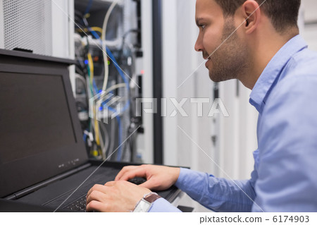Man repairing servers Man repairing servers 6174903