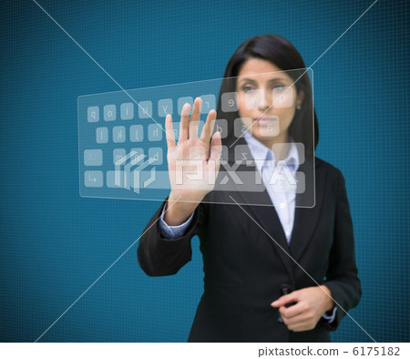 Businesswoman typing on projected digital keyboard 6175182