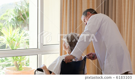 Doctor with his patient looking out the window 6183103