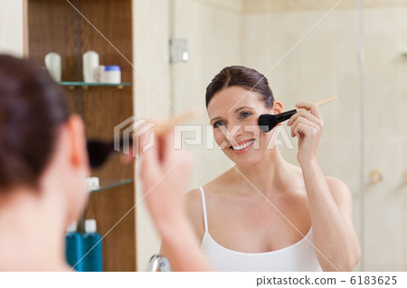 Beautiful women putting make up on Beautiful women putting make up on 6183625