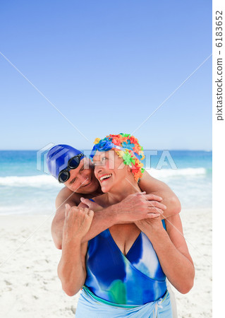 Happy elderly couple on the beach 6183652