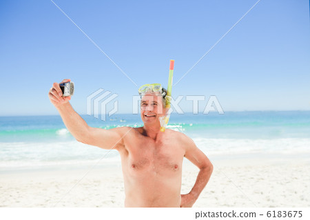 Man taking a photo of himself 6183675