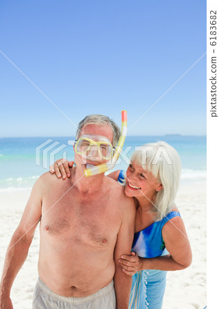 Retired couple on the beach 6183682