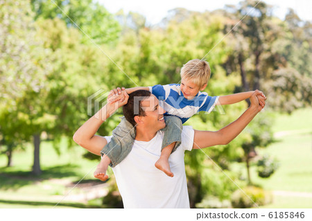 Man giving son a piggyback Man giving son a piggyback 6185846