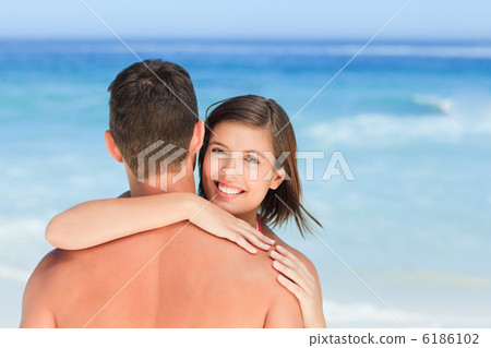 Lovers at the beach Lovers at the beach 6186102