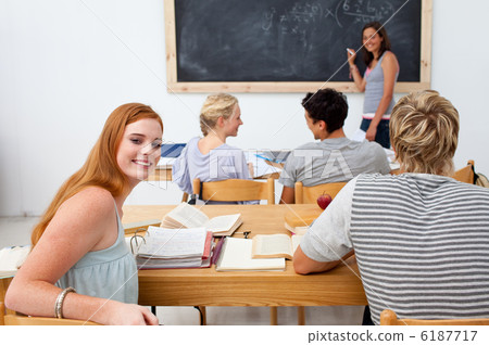 Teenagers studying together in a class Teenagers studying together in a class 6187717