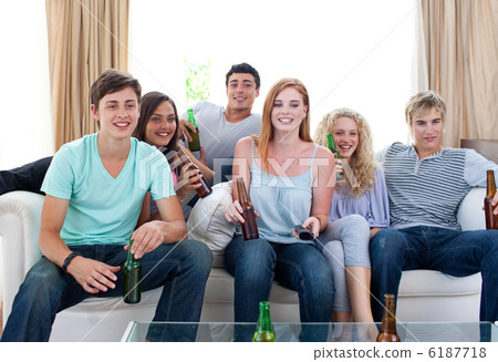 Friends drinking beer at home Friends drinking beer at home 6187718
