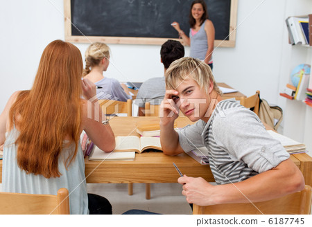 Teenagers studying together in a class 6187745