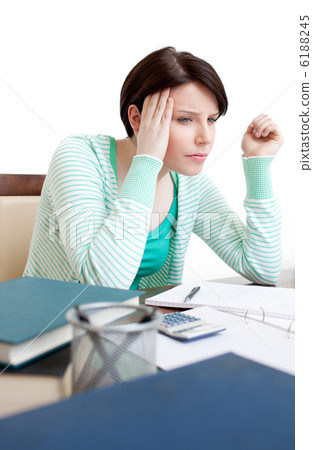Depressed student doing her homework Depressed student doing her homework 6188245
