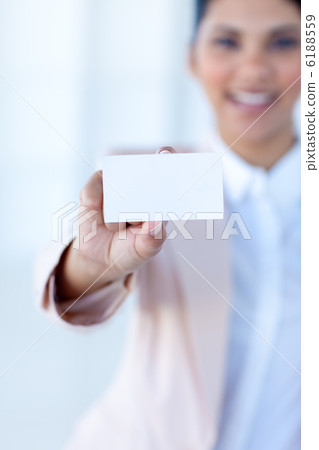 Businesswoman holding a white card 6188559