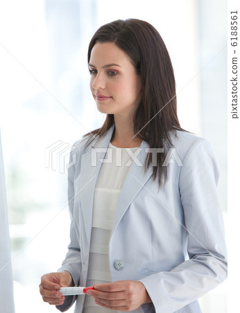 Businesswoman listening to her team in a presentation Businesswoman listening to her team in a presentation 6188561