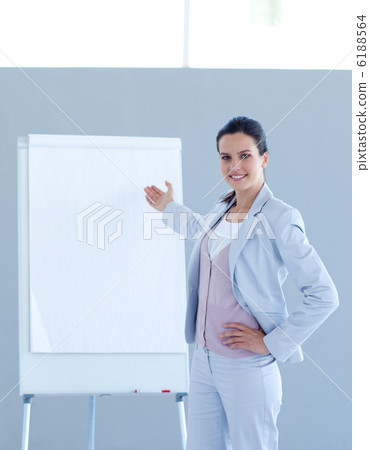 Businesswoman pointing to a whiteboard Businesswoman pointing to a whiteboard 6188564