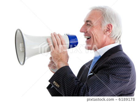 Senior smiling businessman using a megaphone 6189178